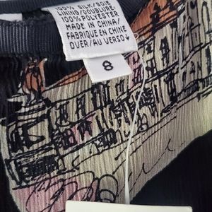 Dana Buchman, women's size 8, black with pink and green pattern, skirt.